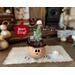 A Christmas elf collectable that has a carved face to light with a battery candle. Bing the elf has a custom pointy hat with faux fur trim.